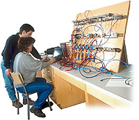Two people working on a circuit board